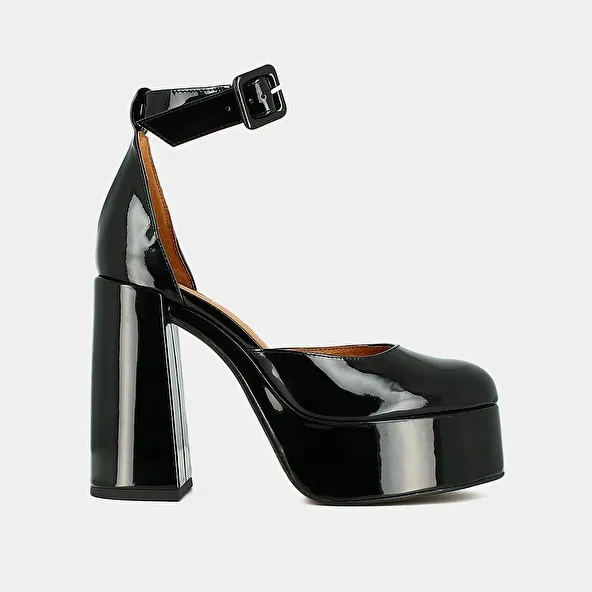 High heels and platforms in black patent leather