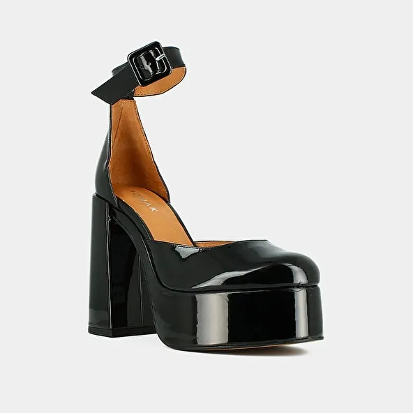 High heels and platforms in black patent leather