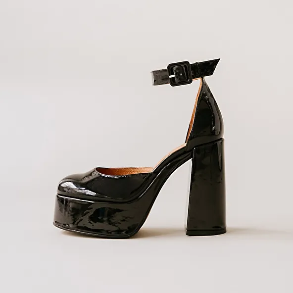 High heels and platforms in black patent leather