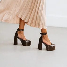 High heels and platforms in dark brown patent leather