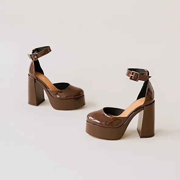 High heels and platforms in dark brown patent leather