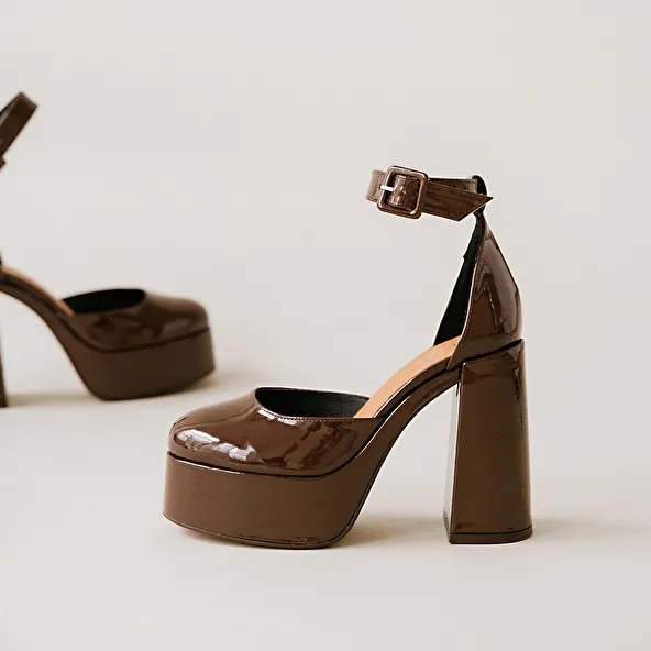 High heels and platforms in dark brown patent leather