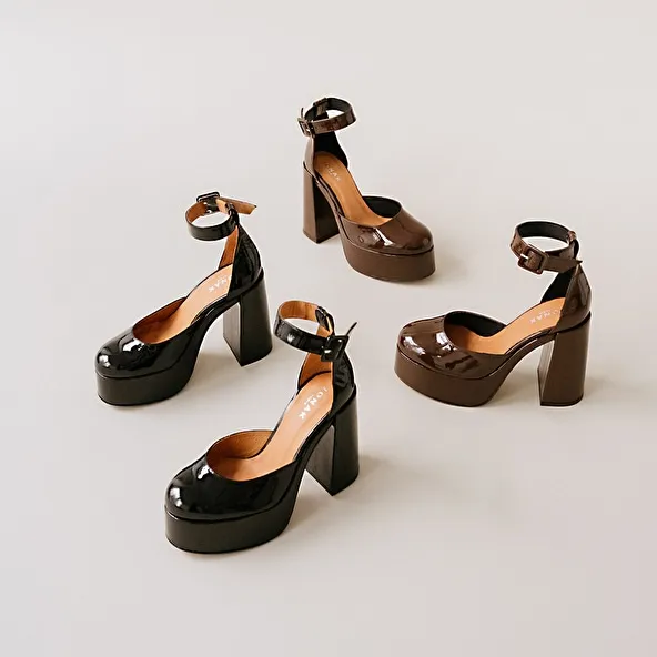 High heels and platforms in dark brown patent leather